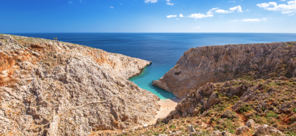 A breathtaking cliff overlooking one of the best Greek beaches and the vast expanse of the ocean.