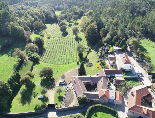 An aerial view of a farm in the countryside.