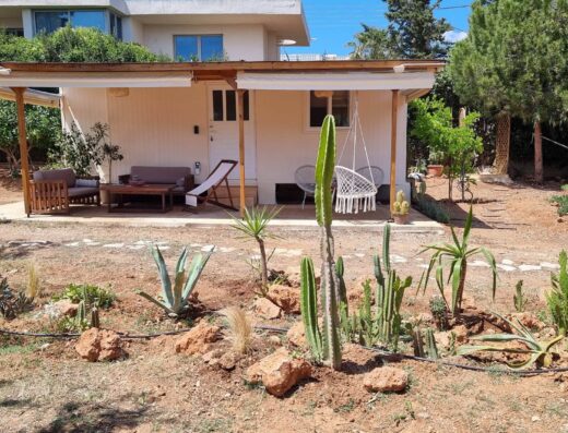 A house with a porch and a swing.