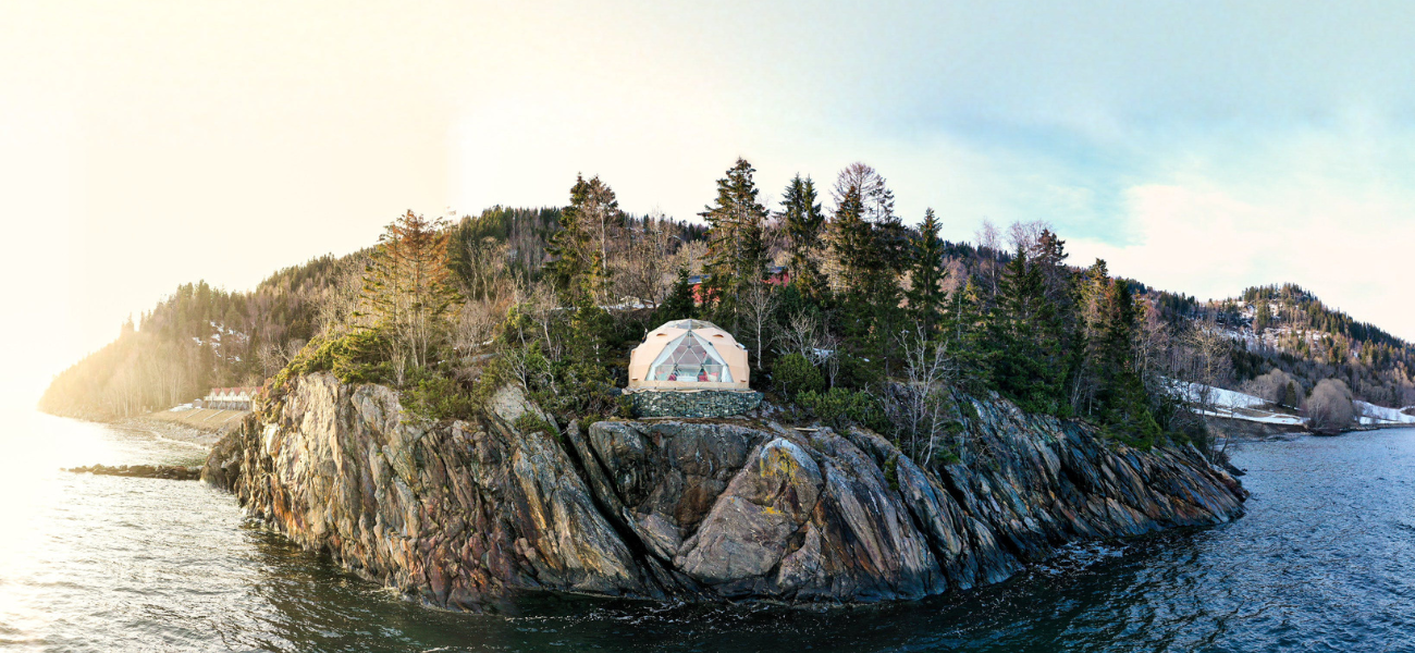A small island with a church on top, offering a glamorous version of camping.